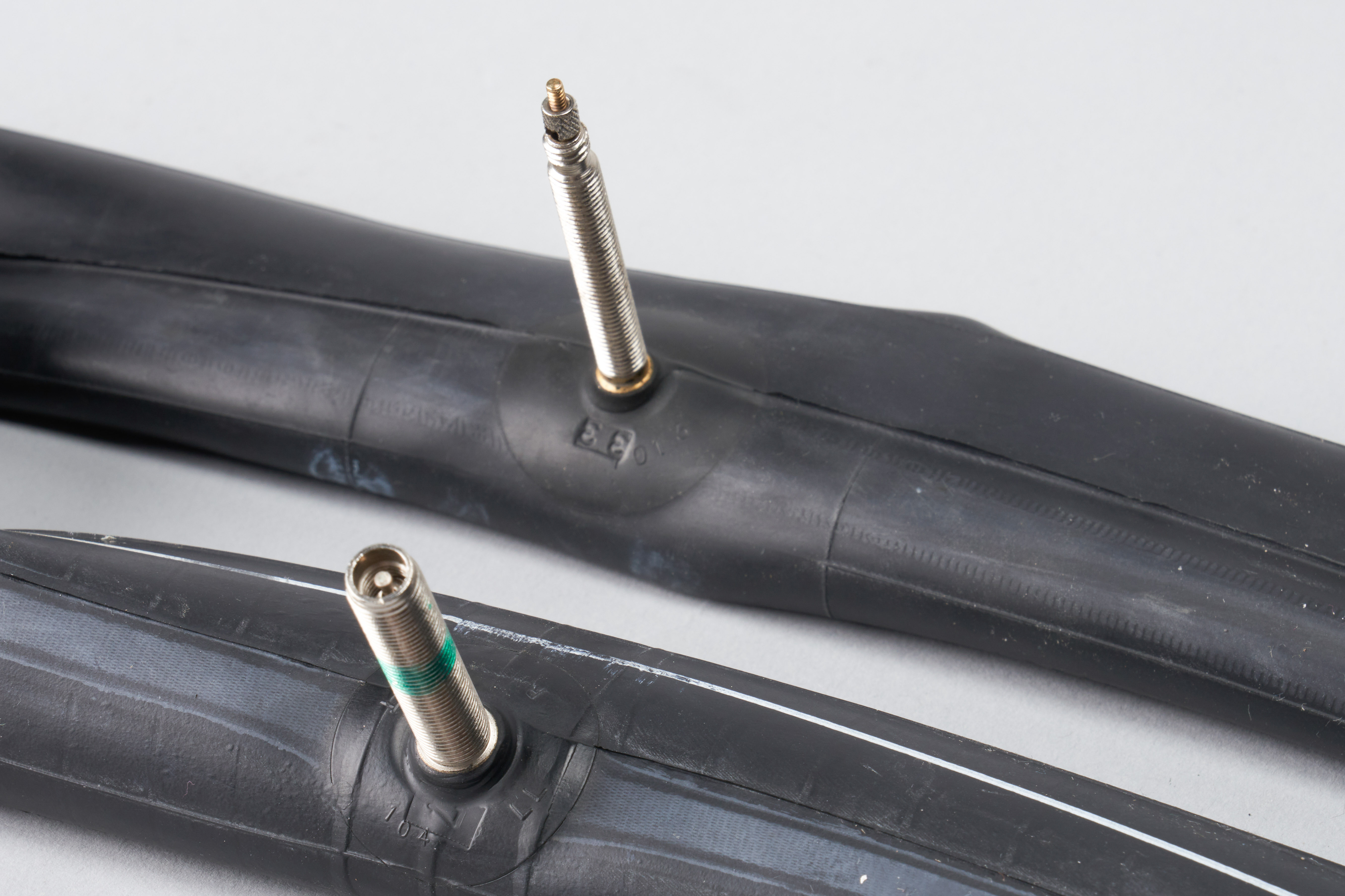 Close-up comparison of Presta and Schrader valve mechanisms